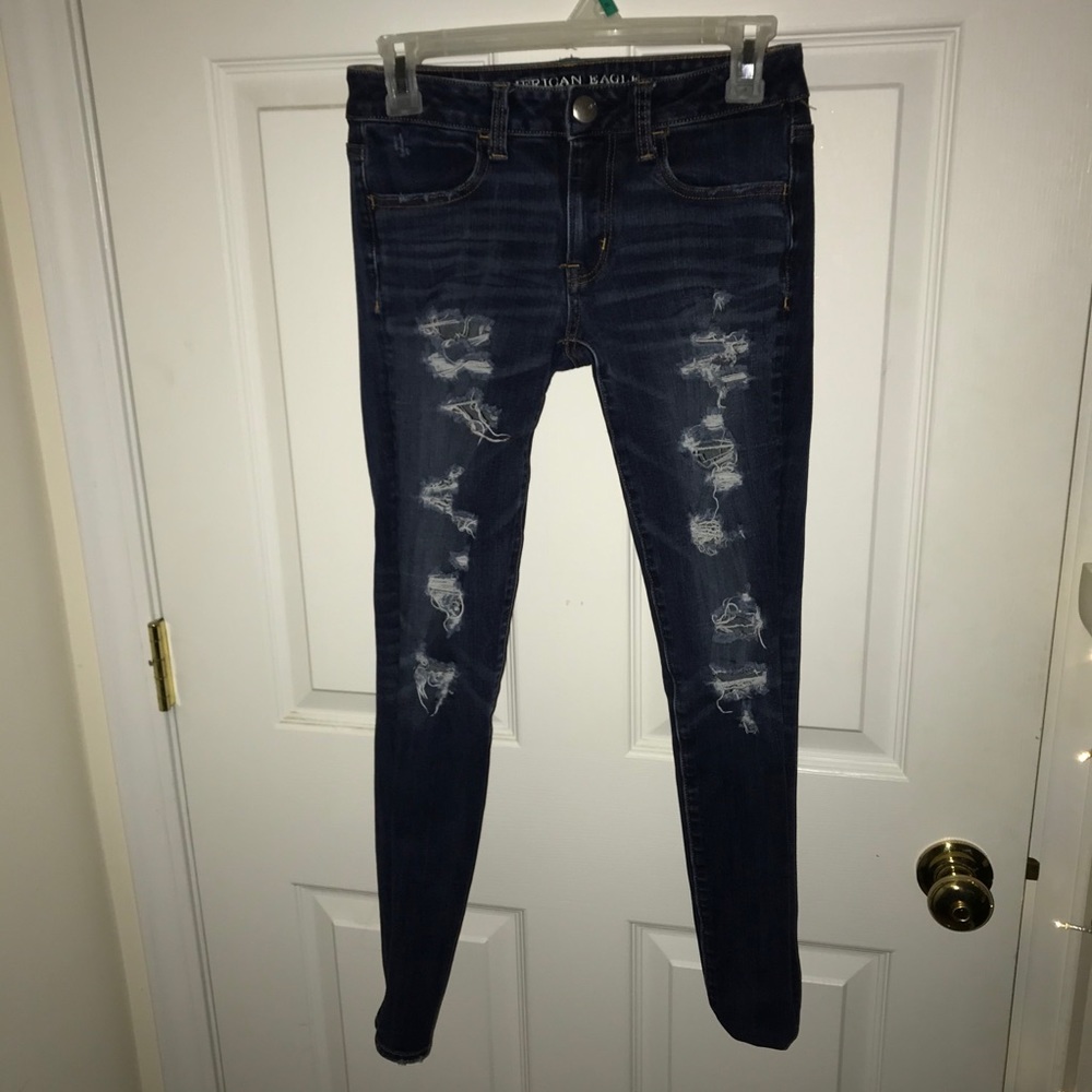 Holy dark blue jeans